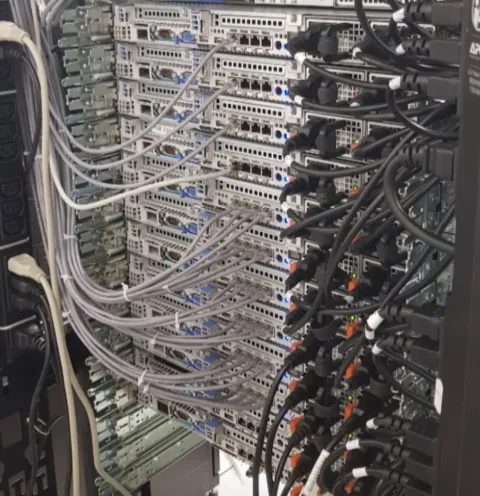 Rear of a datacenter rack — patch and power cabling on Dell servers