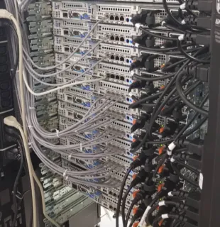 Rear of a datacenter rack — patch and power cabling on Dell servers