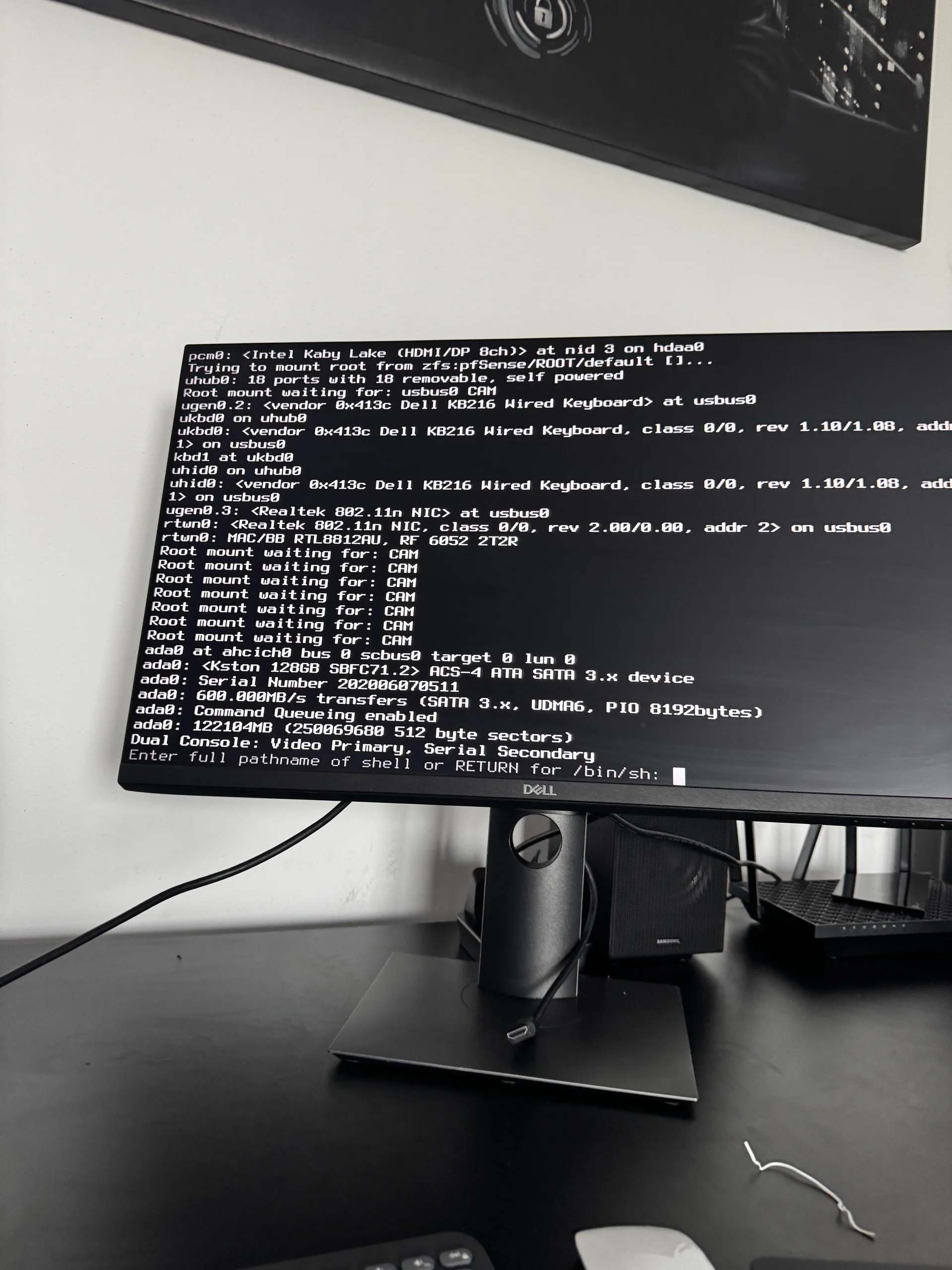 Boot log showing 7x CAM retries, disk detected, Dual Console mode, and single-user shell prompt